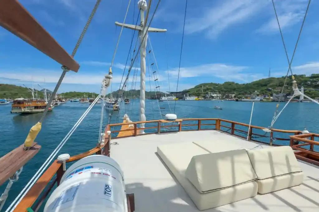 The sun deck of a Komodo liveaboard with islands on the horizon